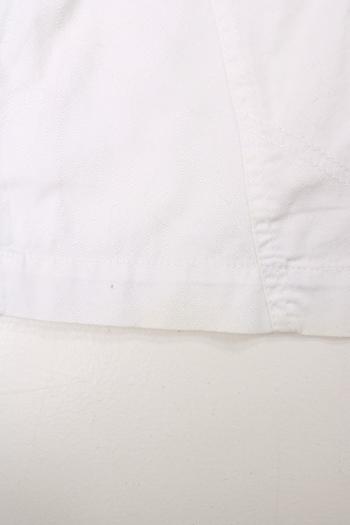 Y2K white and pink, Bench mini skirt. Features printed logo, and embroidered detailing on the pocket.