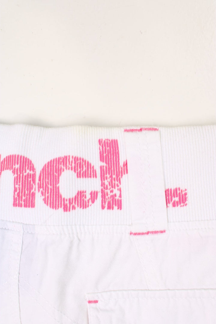 Y2K white and pink, Bench mini skirt. Features printed logo, and embroidered detailing on the pocket.