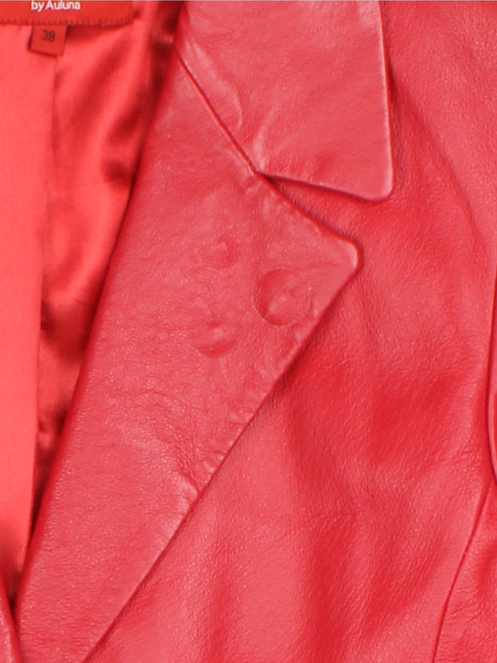 Vintage Leather Jacket in a red colourway, buttons up and has side pockets, and a large collar.