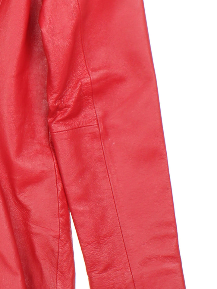 Vintage Leather Jacket in a red colourway, buttons up and has side pockets, and a large collar.