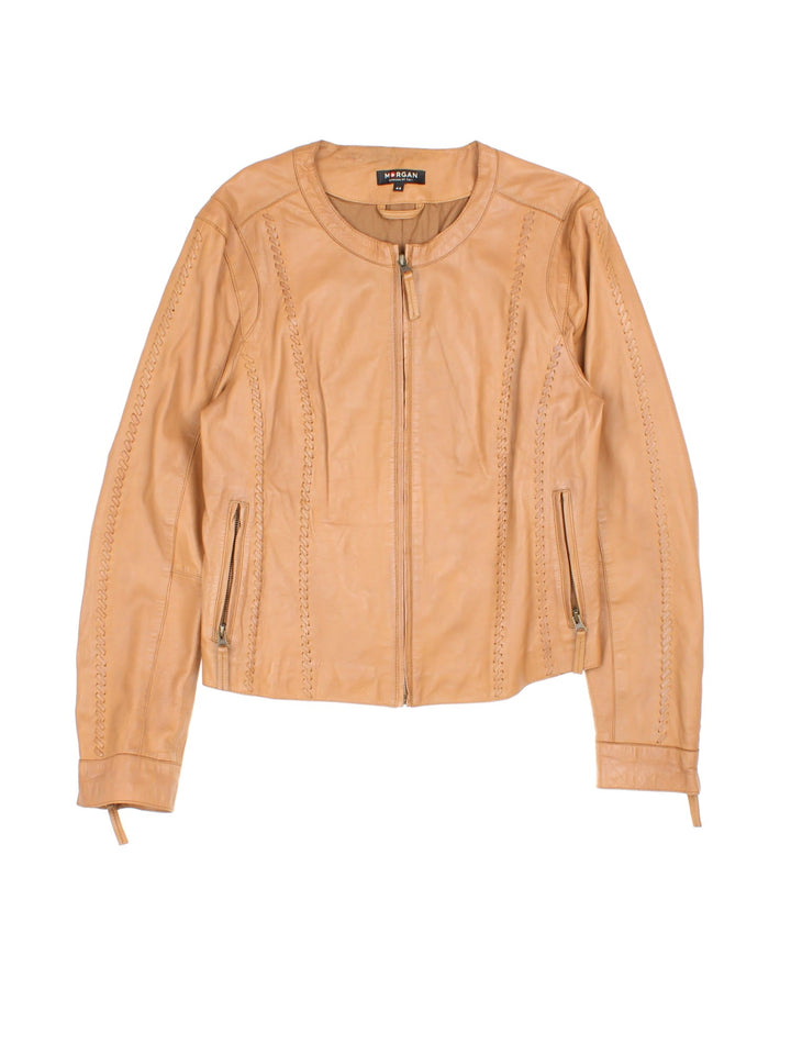 Vintage Western Style Leather Jacket in a tan colourway, zips up and has side pockets, and has cross stitching features going down the sides.