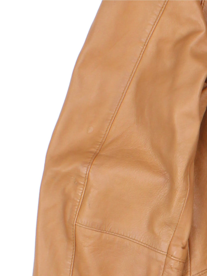 Vintage Western Style Leather Jacket in a tan colourway, zips up and has side pockets, and has cross stitching features going down the sides.