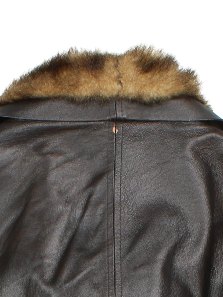 Vintage Y2K Morgan De Toi Faux Fur Collar Leather Jacket in a brown colourway, zips up and has a big faux fur collar and has multiple pockets.