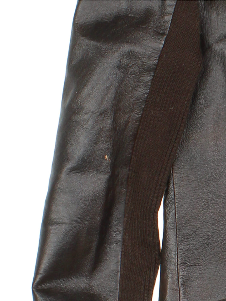 Vintage Y2K Morgan De Toi Faux Fur Collar Leather Jacket in a brown colourway, zips up and has a big faux fur collar and has multiple pockets.