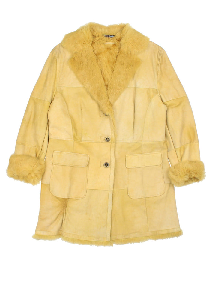 Vintage Afghan Coat in a yellow colourway, buttons up and has side pockets, and big fur collar and cuffs.