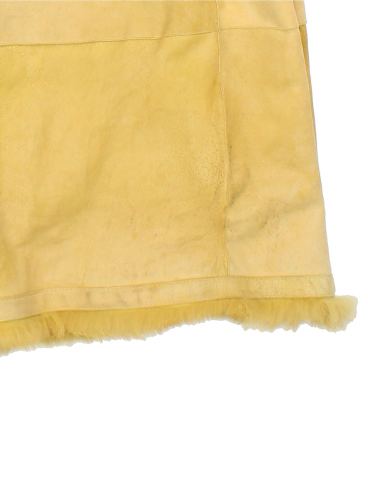 Vintage Afghan Coat in a yellow colourway, buttons up and has side pockets, and big fur collar and cuffs.