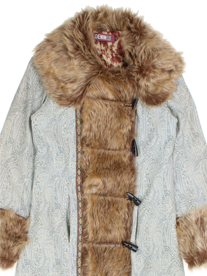 Vintage Y2K Tapestry Patterned Afghan Coat in a blue colourway, buttons up and has side pockets, big fur collar and features on the front, and has tapestry patterns throughout.