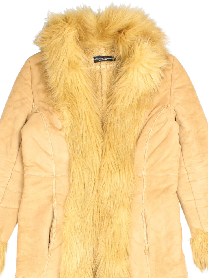 Vintage Y2K Dorothy Perkins Afghan Coat in a tan colourway, clasp closures, has side pockets and a big fur lining and collar.