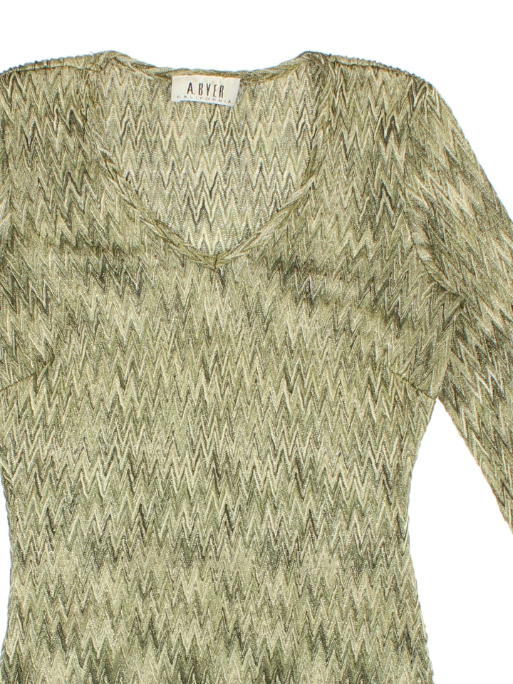 Y2K Top in a green colourway, v neck detail and all over zig zag pattern.
