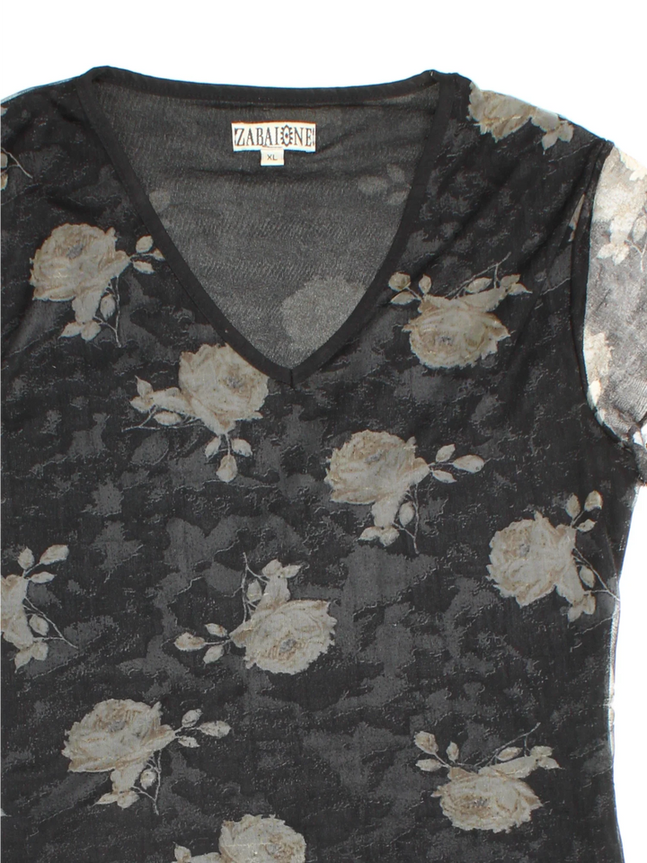 Y2K Floral Print Top in a black colourway. V neckline, sheer overlay and all over floral pattern.