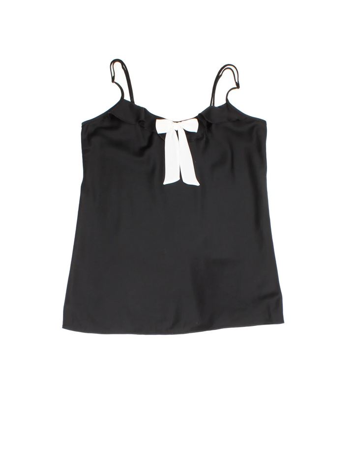 Y2K Bow Vest in a black/white colourway. Adjustable straps, bow detail and frill hemline.