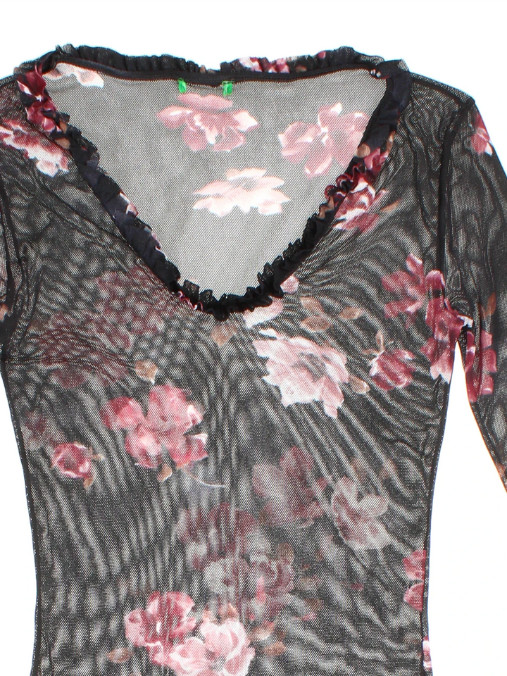 Y2K Floral Mesh Top in a black/pink colourway. V neckline, frill hem and all over floral pattern.