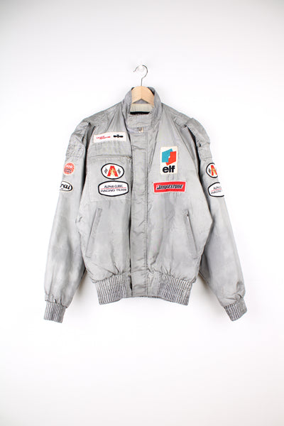 Vintage Alpha Cubic nylon bomber style formula 1 racing jacket in grey, features all over embroidered badges/patches and full zip