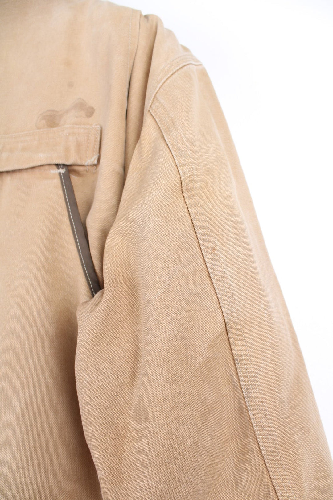  Hunting Jacket in a  browwn colourway with cordurory collar and shoulder pads. Buttons up and has multiple utility pockets including a big detachable pouch pocket on the back, insulated with a blanket lining, and has the logos embroidered on the front.