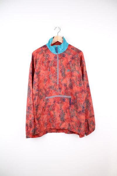 Vintage Nike ACG pack away pullover Windbreaker in red and blue. Features embroidered logo, half zip and pouch pocket.