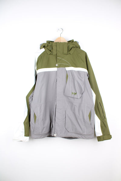 Green, white and grey Helly Hansen, Helly Tech ski jacket. Features chest pocket, pocket on each sleeve, two inside pockets, removable hood and snow skirt. 