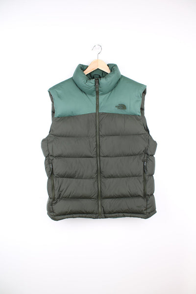 The North Face puffer gilet in green featuring embroidered logo on the chest. 