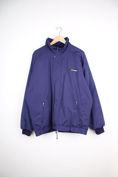 Navy blue Berghaus bomber Jacket. Features embroidered logo on the chest. 