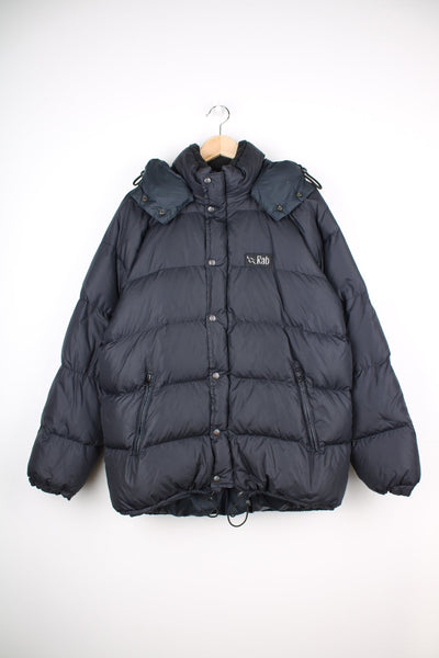 Rab puffer coat in black featuring embroidered logo on the chest.