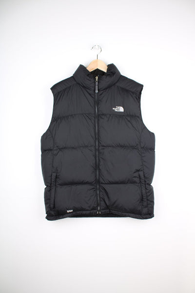 The North Face 550 black gilet. Features embroidered logo on the front and back.