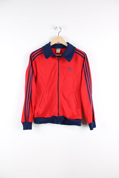 Vintage 80's red and blue Adidas tracksuit top, features embroidered logo on the chest and signature three stripes down the arms