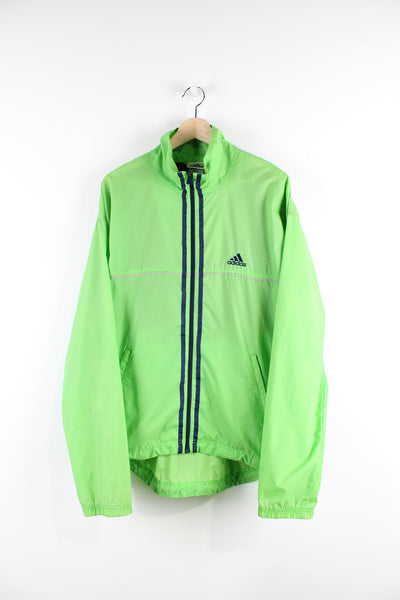 Vintage green tracksuit jacket with embroidered logo on the chest and blue three stripe feature down the front and sides