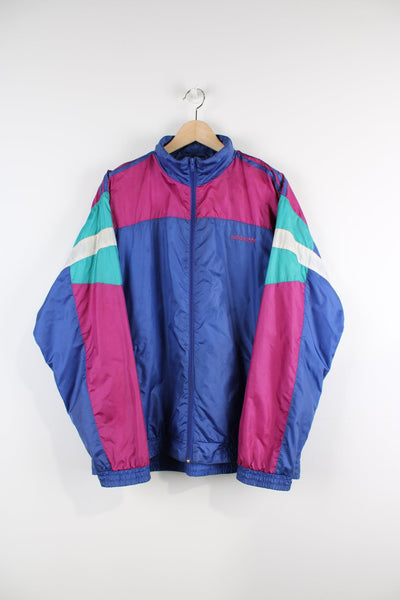 Vintage 90s Adidas purple tracksuit top with embroidered logo on the chest as well as purple, green and white panel features on both arms.  