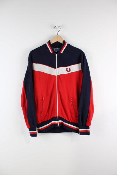 Vintage red and blue Fred Perry tracksuit top. Features embroidered logo.