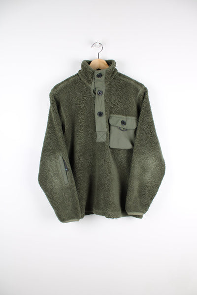 Green Nike ACG teddy style fleece with pocket on the chest.