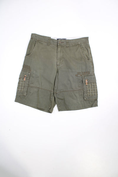 Vintage Oakley cargo shorts in khaki green. Features stitch detailing.