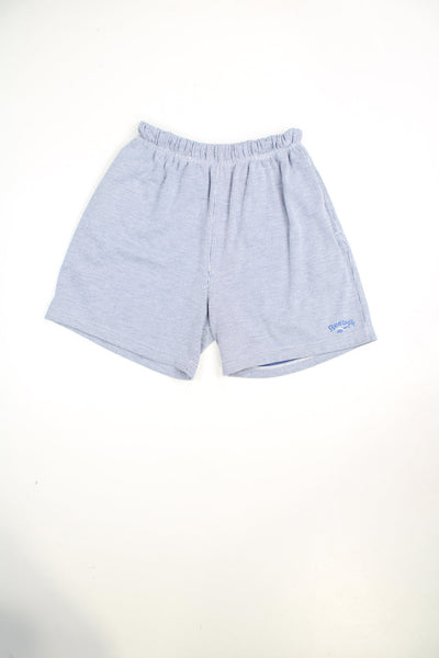Blue and white pinstripe Reebok shorts with elasticated waist and drawstring. Features embroidered logo.