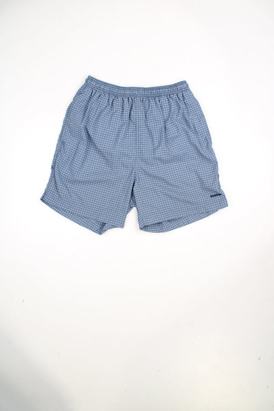 Blue Reebok checked swim shorts with elasticated waist and drawstring. Features embroidered logo.