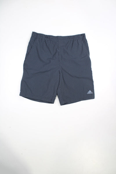 Grey Adidas shorts with blue checks, elasticated waist and drawstring. Features embroidered logo.