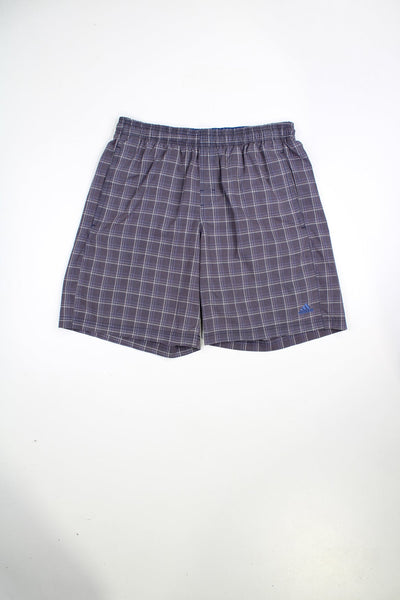 Purple Adidas check shorts with elasticated waist and drawstring. Features embroidered logo.