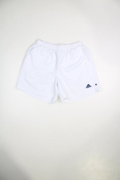 Vintage Adidas shorts with elasticated waist and drawstring. Features embroidered logo on the front and back.