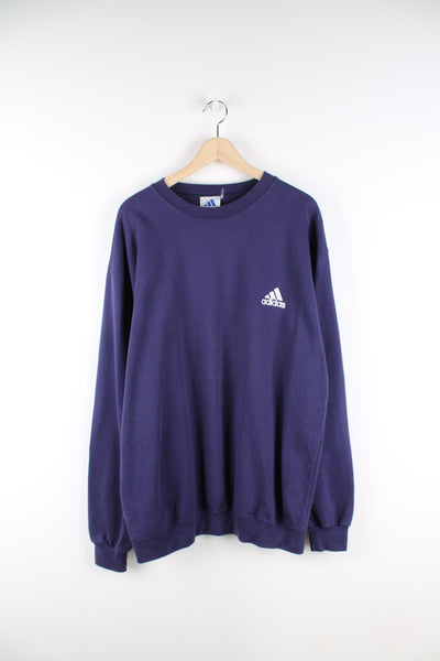 Blue Adidas crew neck sweatshirt with embroidered logo on the chest.