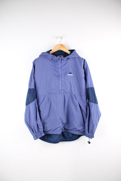 Vintage Adidas pullover tracksuit top in purple with half zip. Features embroidered logo on the chest.