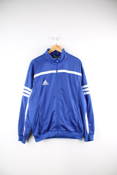Blue Adidas tracksuit top. Features embroidered logo on the chest and signature three stripe detail.