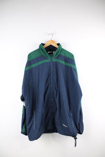 Vintage Reebok tracksuit top in blue and green. Features puff print logo, and embroidered logo on the back.