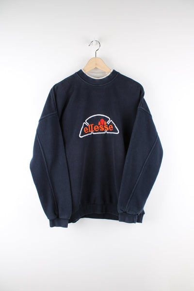 Vintage blue Ellesse sweatshirt with embroidered logo across the chest.