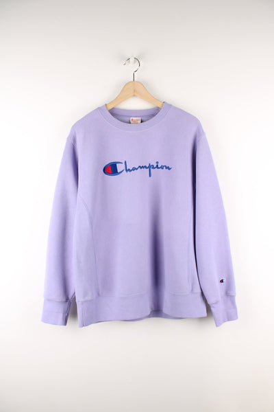 Purple Champion Reverse Weave sweatshirt with embroidered logo across the chest.