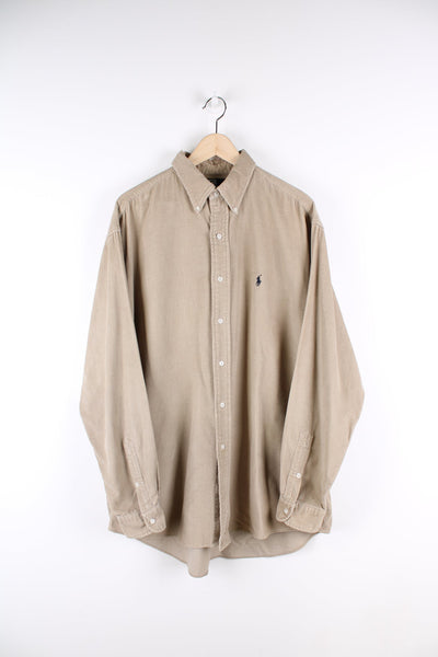 Ralph Lauren beige corduroy button up shirt with signature embroidered logo on the chest in navy.