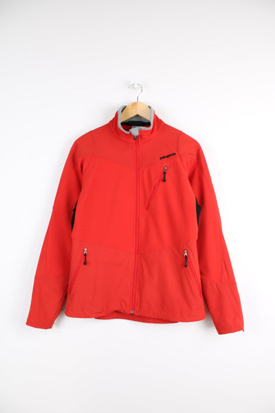 Women's Patagonia red zip through jacket, features multiple pockets embroidered logo on the chest 