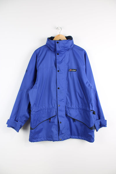 Berghaus Driaqua indigo blue zip through outdoor jacket, features multiple pockets and foldaway hood