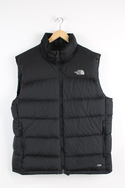 The North Face 700 Men's all black zip through puffer gilet, features signature logo on the chest