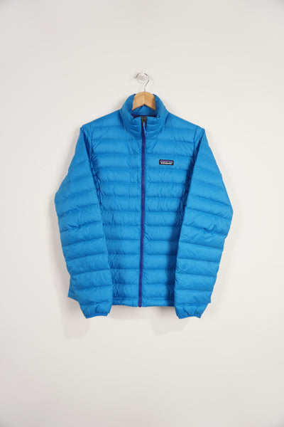 All blue Patagonia lightly padded puffer jacket with zip up pockets and embroidered logo on the chest