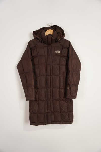 The North Face brown 600 hooded puffer jacket with double pockets and embroidered logos on the front and back 