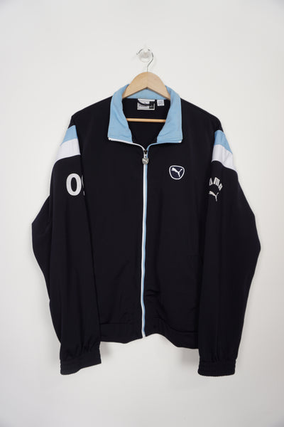 Puma navy blue Puma tracksuit top with embroidered logo and printed details on the sleeves