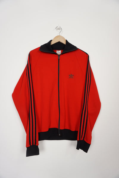 Vintage 70's/80's made in England red and black Adidas track jacket with three stripe details down the sleeves and embroidered logo on the chest
