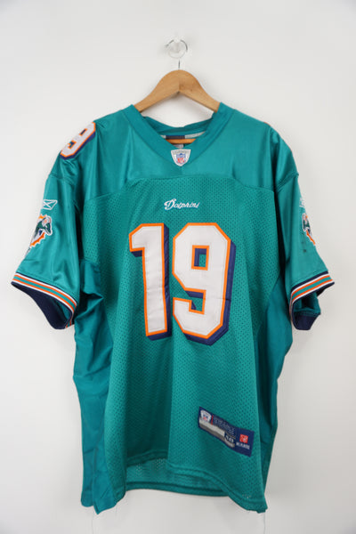 Miami Dolphins Brandon Marshall #19 NFL Reebok jersey. Embroidered Logos and number on front and back. Jersey colour green/orange Jersey in good condition, few black marks on both sleeves Size in Label: 48 (XL)